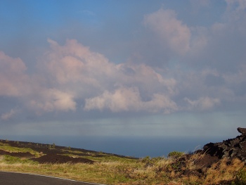 Smoke coloring the clouds.