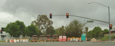 Tons of construction barriers, signs, and even an outhouse