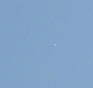 Small bright object in the daytime sky.