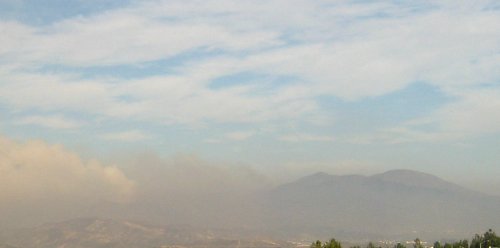 Smoke rises from in front of Saddleback