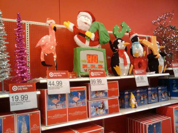 Store shelf with Christmas decorations on it already.