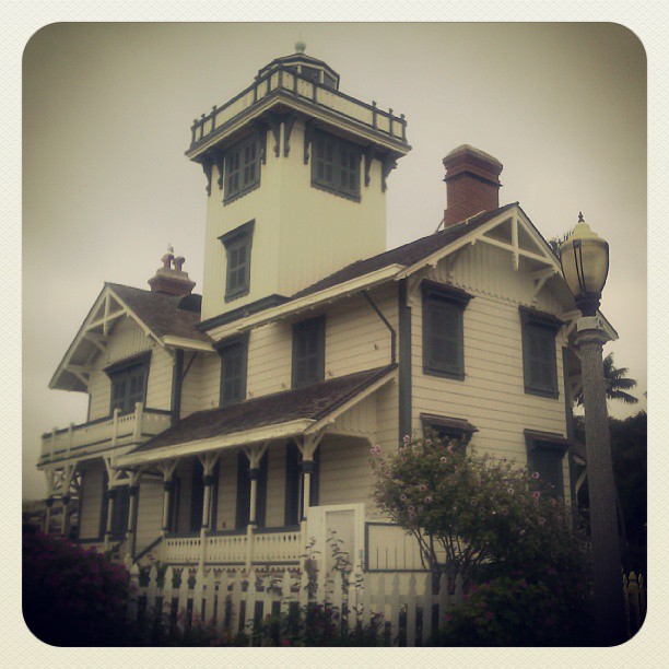 The same house, but this time it's sepia-toned and fading darker toward the corners. It fills a a square frame with a border that makes it look like the holder in a really old photo album. And the angle is just different enough to make it look fuller, or bulging, or perhaps even looming above the viewer.