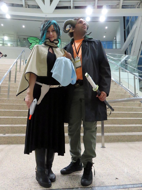 Cosplayers as Saga's Alana and Marko holding baby Hazel in imitation of the cover of Saga #1.