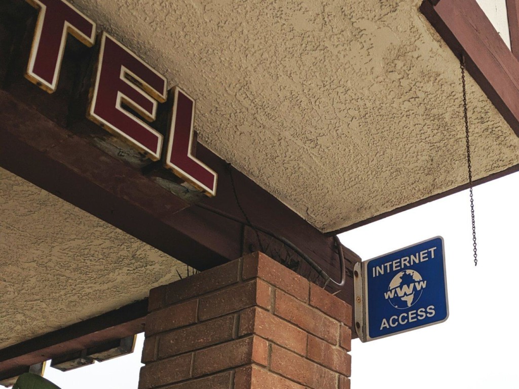 Sign on a pillar proclaiming "Internet WWW Access."