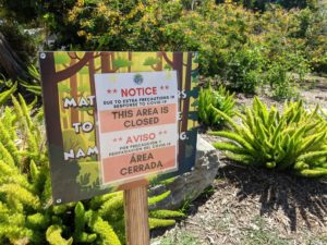 Sign with a "This area is closed" warning.