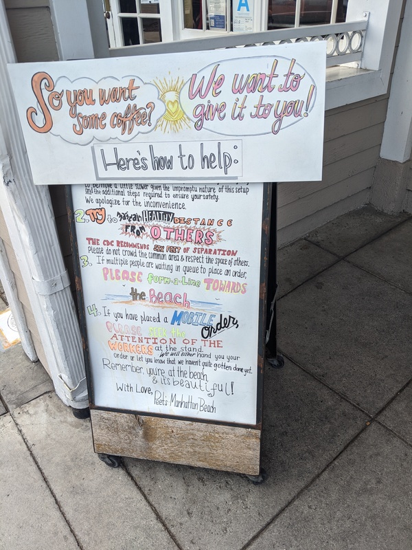 Signboard completely covered with how to order coffee safely during the pandemic.