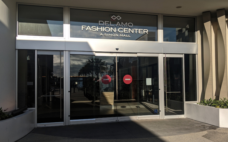 Mall entrance with Do Not Enter signs on the doors