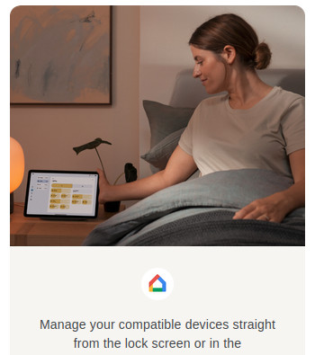 A woman sits in bed, reaching for a tablet device on the night stand. Just behind her hand is a houseplant with a long stem and one leaf, seen almost on edge such that it looks like a claw hammer in profile.